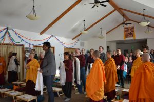 Students of Venerable Thubten Chodron line up to present her with ceremonial blessing scarves for her anniversary celebration.