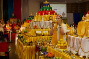Ritual offerer (chödpön) Elena Kamarova of Moscow, Russia makes offerings to the southern mandala