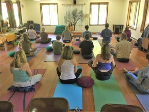 Jackie Lila Moon teaching yoga during a daylong retreat at Lost Valley Education Center