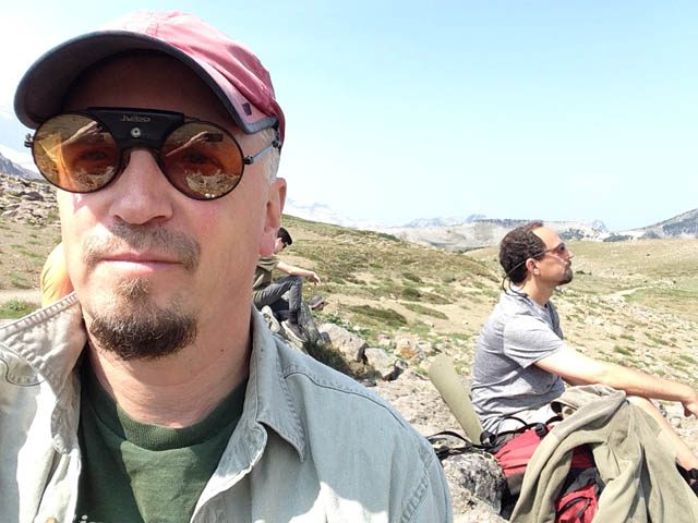 Mountain meditation hike Leader Ewan Magie (foreground), and friend Mayne Tabachnik, meditate near Berkeley Park on Mt. Rainier