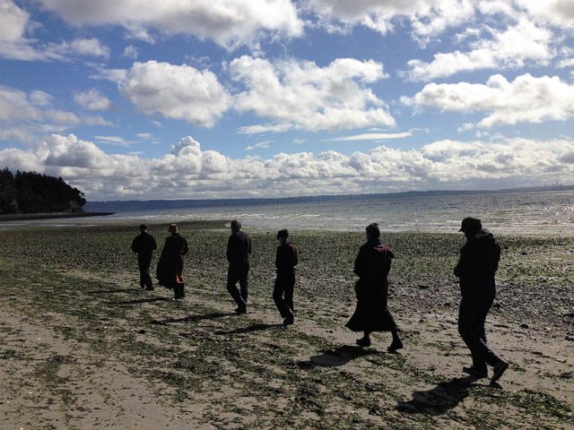 Magie and others do formal walking meditation, called Kinhin, during a fall sesshin at Camp Indianola on the shores of Puget Sound