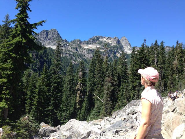 Johanna Hose gazes in silent awe at Cascade Range peaks, near Snoqualmie Pass