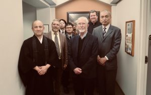 Participants gather in front of the astrology mandala of Shingon Buddhism displayed at the Pigott Building at Seattle University. From left Rev. Taijo, Dr. Peduti, Prof. Tokushige, Prof. Kikuya, Dr. Ely, Dr. Wirth, Prof. Sato