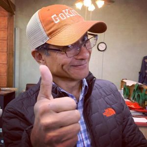 Dzogchen Ponlop Rinpoche sporting a "Go Kind" hat he designed, intended to increase compassion and “kindfulness” in daily life