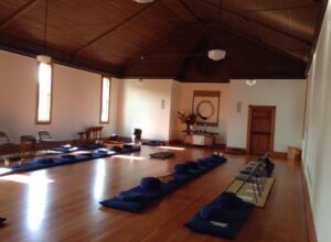 The meditation hall has cushions and chairs available