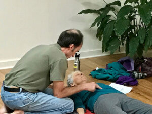 Charles Matoon and Aviva Suchow working together at a pre-covid Zen Jin Shin workshop