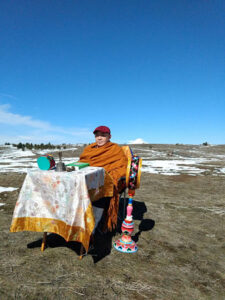 Khenpo blessing the retreat land with prayers of harmony for beings and the environment