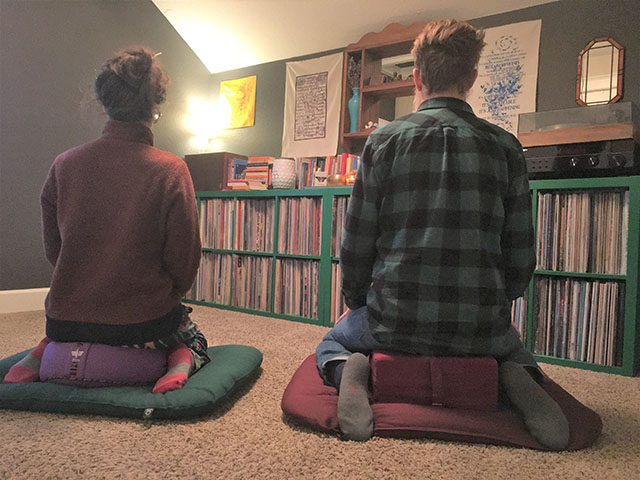 Jake and Jane W. meditating in their home