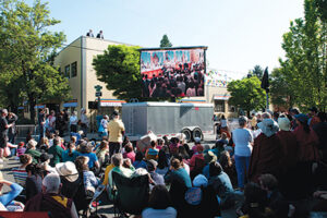 Maitripa College neighbors watch His Holiness the Dalai Lama’s visit on the big screen
