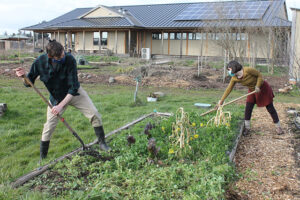 A socially distanced and masked garden work party in February. From left to right: Benjamin Bigelow and Christina Steurer