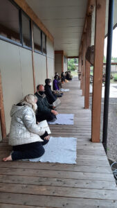 Chanting service outdoors during zazenkai, an all-day retreat in May