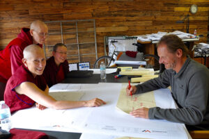 Part of the abbey building team meets with the architect. Left to right Venerable Chodron, Venerable Tarpa, Venerable Damcho, and Tim Wilson