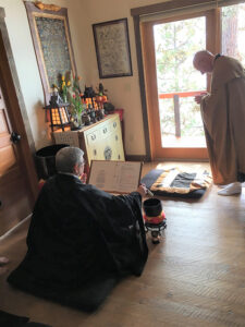 Zenku Sensei bows to the Mountains and Water Zendo altar to start the priest ordination ceremony