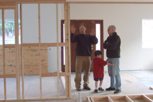 Burnett and Red Cedar Dharma Hall co-founder Reizan Bob Penny, and Penny’s son, remodeling the hall