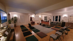The Interior of the Open Way Mindfulness Center in Missoula, Montana, with video for Zoom participants and zabutons socially distanced