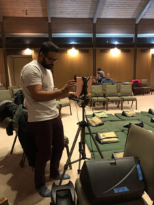 Kalid Azad, our current facilities manager, assists set-up of our current hybrid audio visual gear at University Friends