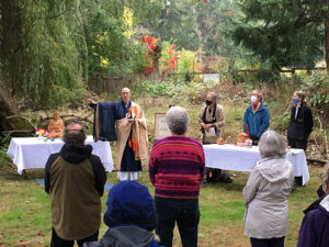 Cain speaks to sangha members, at the blessing ceremony that consecrated their new home