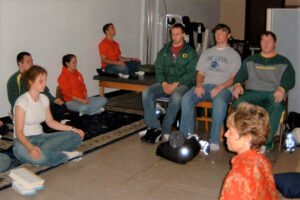 Woollacott teaches meditation to University of Oregon students, as part of a study measuring their EEG responses