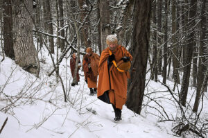 Pacific Hermitage monks, here led by Ajahn Sudanto, sometimes walk through heavy snow