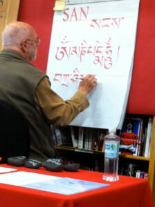 Demonstrating the Tibetan alphabet during a 2012 booksigning for “Tibetan Calligrapy,” at Portland’s Powell’s Book