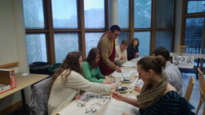 Venerable Tulku Yeshe Gyatso leads a calligraphy demonstration and workshop at the 2014 Arts as Buddhist Practice festival, at Seattle University