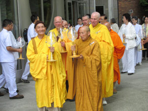 Master Nguyen An (right), and Master Kim Lee (left), from Co Lam Temple in Seattle, lead a 2013 Vesak procession at Seattle University