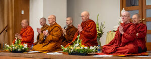 Ajahn Ritti, abbot of Wat Atammayatarama, Ajahn Nisabho, Luang Por Pasanno, founder of Abhayagiri Buddhist monastery, Ajahn Kovilo, Ayyā Anandabodhi, founder of Āloka Vihāra Forest Monastery, as well as Ayyā Santussikā and Ayyā Cittānandā, founders of Karuna Buddhist Vihara, chant together at the Pah Bah.