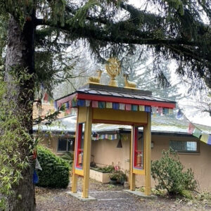 Dharma gate with new prayer wheels, which were gifted by Derek Ridler