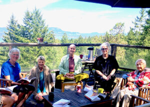 The monthly Kalyana MItta group’s May meeting outside at a member’s home.  From left to right:  Bernadette Mertens-McAllister, Sheri Standen, Christine Mauro  (leader), Andrea Little, Barbara Dams