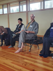 The  group  was graciously welcomed by Dharma Rain Abbot Kokumyo Lowe-Charde. Next to him is Myoyu Haley Voekel, ordained priest at Great Vow Zen Monastery
