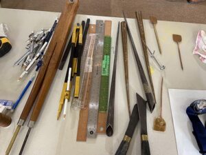 An array of sand mandala tools