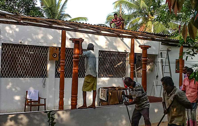 Workers repair and improve Padukka Mathika Matha Bhikkhuni Aramaya, a bhikkhuni monastery in Sri Lanka