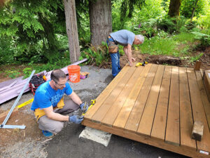 Steve Burkhart and Rich Roskopf, two deeply committed regular volunteers, completing the decks for the first of the yurts