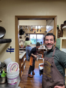 Kitchen manager Todd Turetsky, leads a volunteer team to feed more volunteers