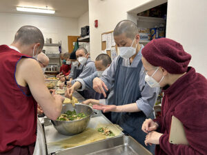 The Dharma Drum Mountain nuns joyfully demonstrate how to make spring rolls with tofu