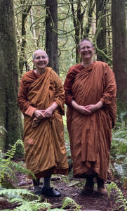 Ayya Suvijjana Bhikkhuni and Ayya Niyyanika Bhikkhuni take a walk (close to their new monastic residence) with a friend in the forest trails  in Evergreen College, Olympia