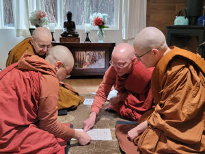 Ayya Santussika Bhikkhuni designating the sima boundary for Karuna Buddhist Vihara, with the help of the Bhikkhunis Ayyas Cittananda, Niyyanika and Suvijjana