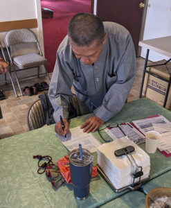 Master Lee Chung signs the lease over to the Salem Zen Center