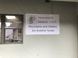 A  first  sign, announcing the newly named Mountains and Waters Zen Buddhist Temple