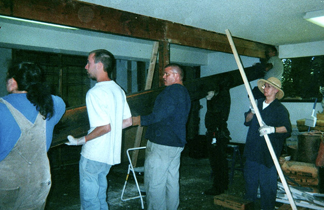 Volunteers raising a  steel beam in the first years of  the Olympia Zen Center