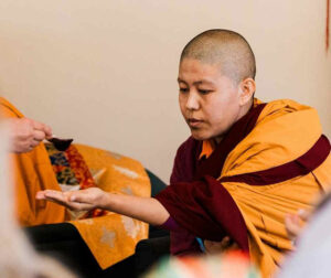 Jetsünma receives an offering during a teaching by Rabjam Rinpoche at the Namchak Retreat Ranch