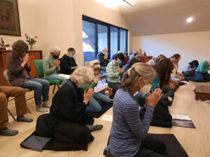 A group bow at a mahasangha gathering, creating intentions for the Bozeman Dharma Center sangha