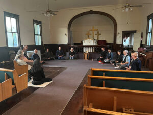 Upon receiving keys for the new building, the No-Rank Zendo sangha gathered for a sit in the sanctuary as it was