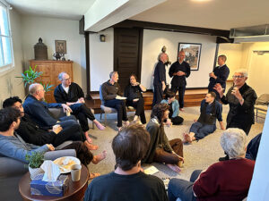 Members of the No-Rank Zen Temple socialize with visitors in front of the newly renovated dokusan room, during the dedication ceremony reception