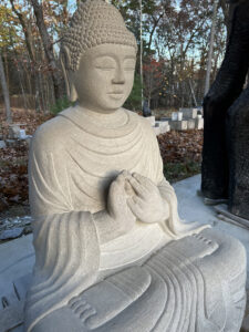 Nearly complete is the stone Buddha sculpture by Thomas Matsuda, working in his studio in Leverett, Massachusetts