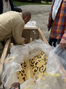 Rev. Senji uncrating the  sorin (spire)  for  the  peace  pagoda