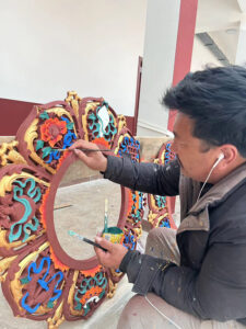 Many artisans completed the  traditional painting of the shedra