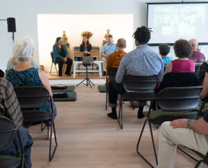 Guiding teachers Tuere Sala, Keri Pederson, and Tim Geil introducing a ceremony, at Seattle Insight’s opening last June