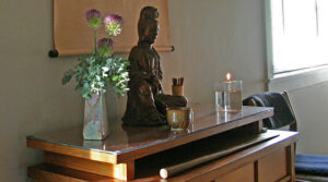 Temple altar with Kannon (Guanyin) statue, and ikebana flower arrangement by member Ace Davis