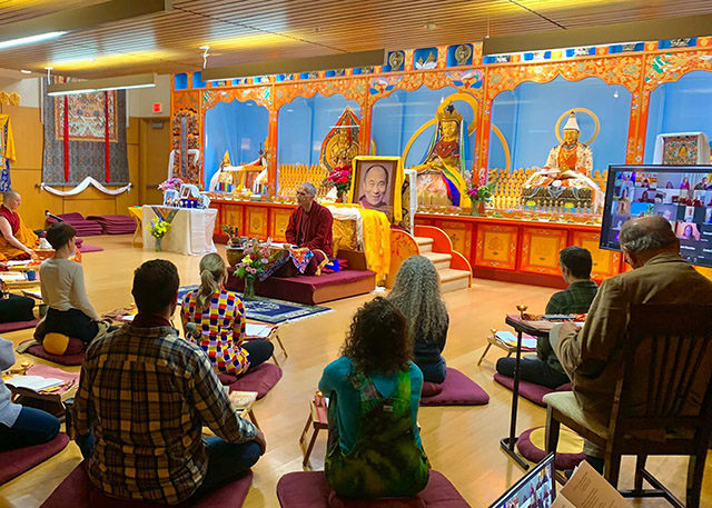Yangsi Rinpoche teaching a meditation class in the Maitripa Jokhang, using the evolving hybrid model that accommodates in-person and online students